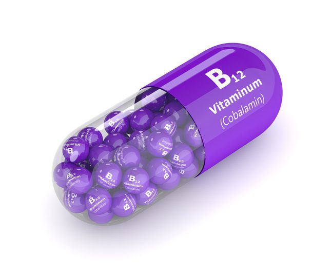 3d rendering vitamin B12 pill with granules over white background. Concept of dietary supplements